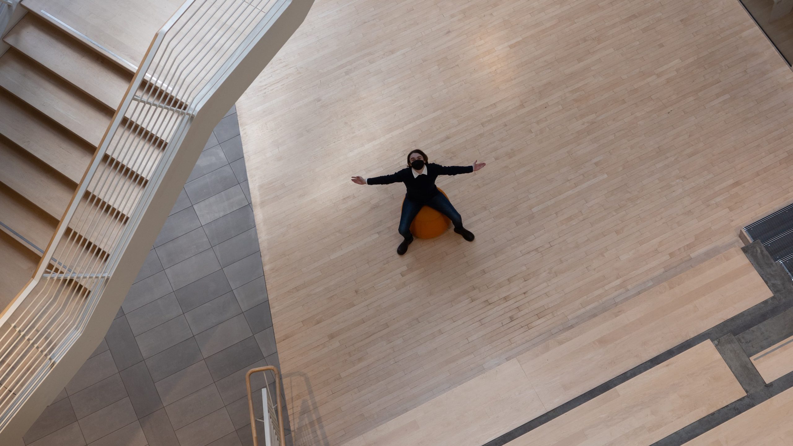 a photo taken from high above showing a person with their arms spread out.